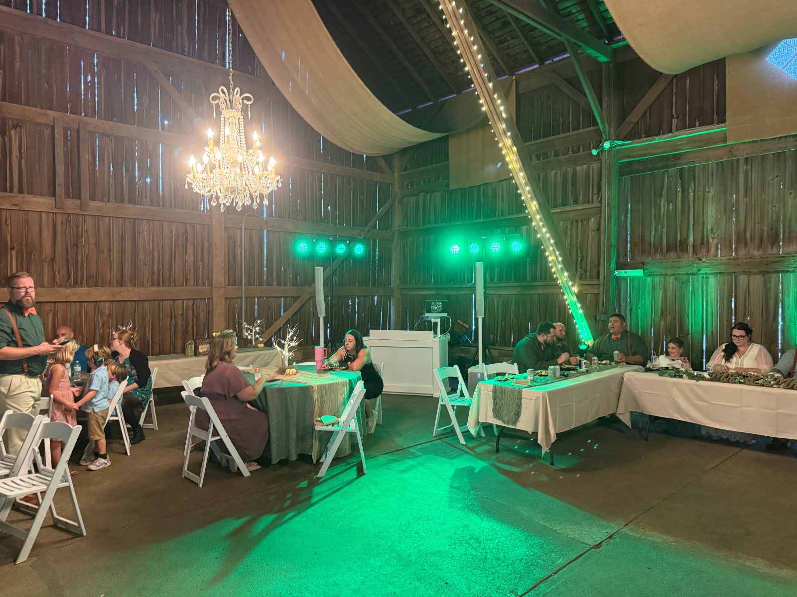 Barn wedding reception lit by Topher DJ Company